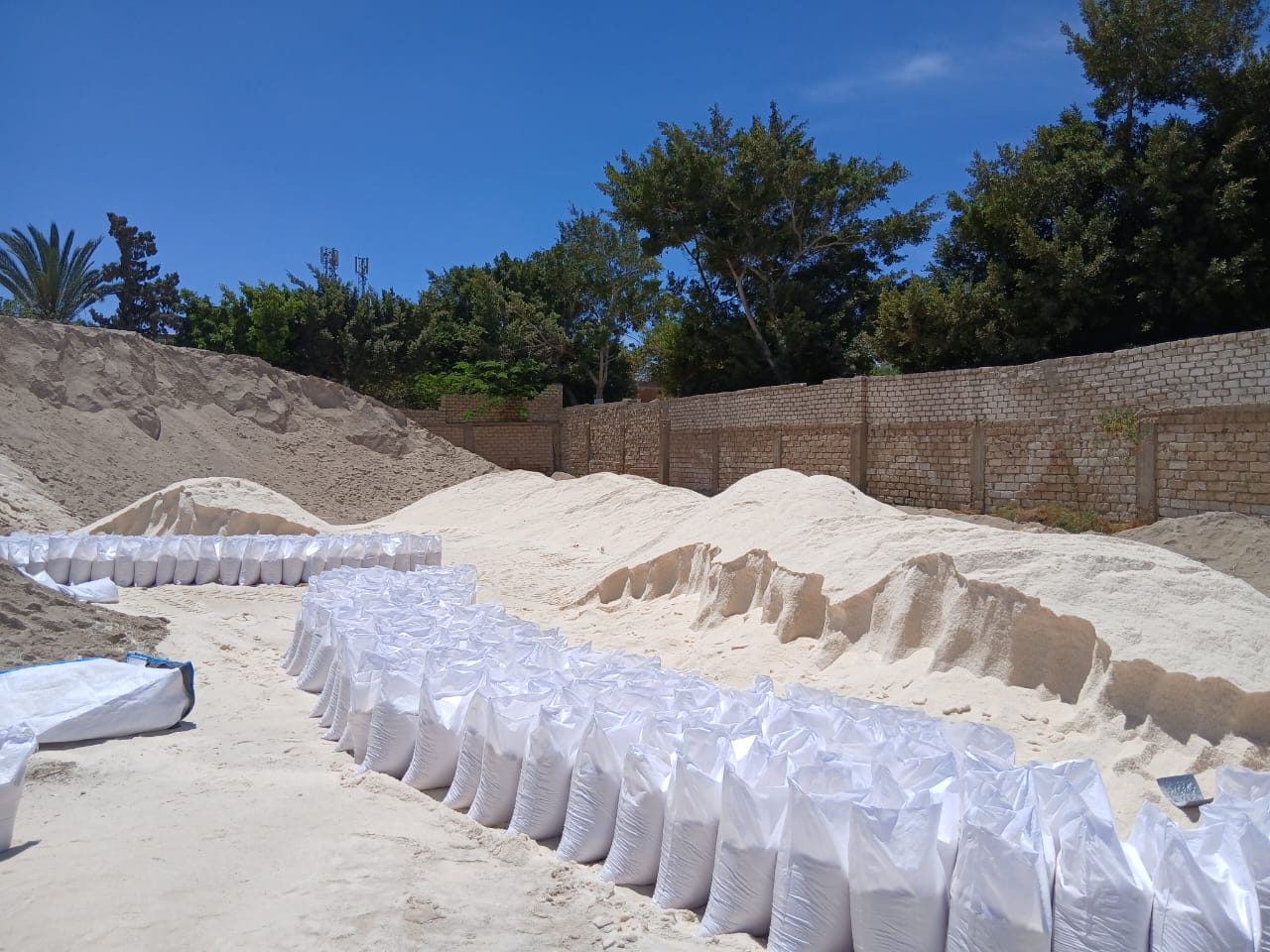 Stacked bulk bags in yard
